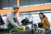 Mom and son in line at checkout in grocery store