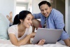 Couple watching videos on a laptop